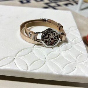Rose gold metallic wrap bracelet with silver filigree charm